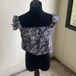 Black and white floral crop top with ruffles sleeves.